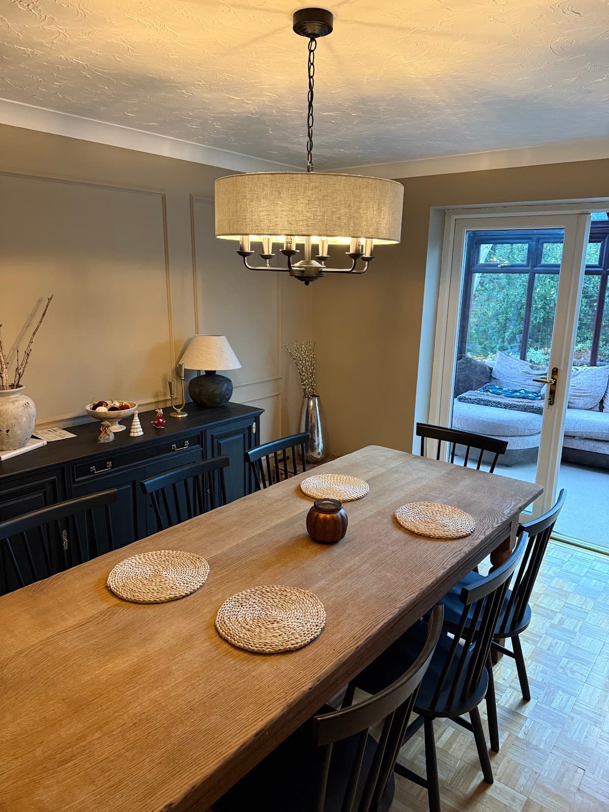 Drum pendant light fitted over a dining table
