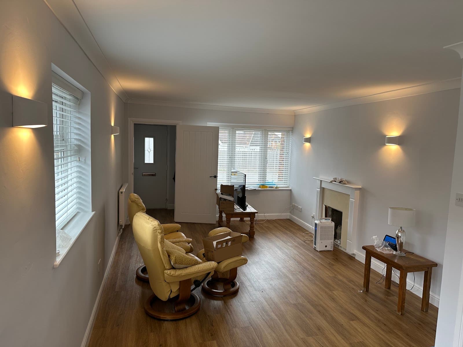 Up-and-down wall lights fitted around a living room