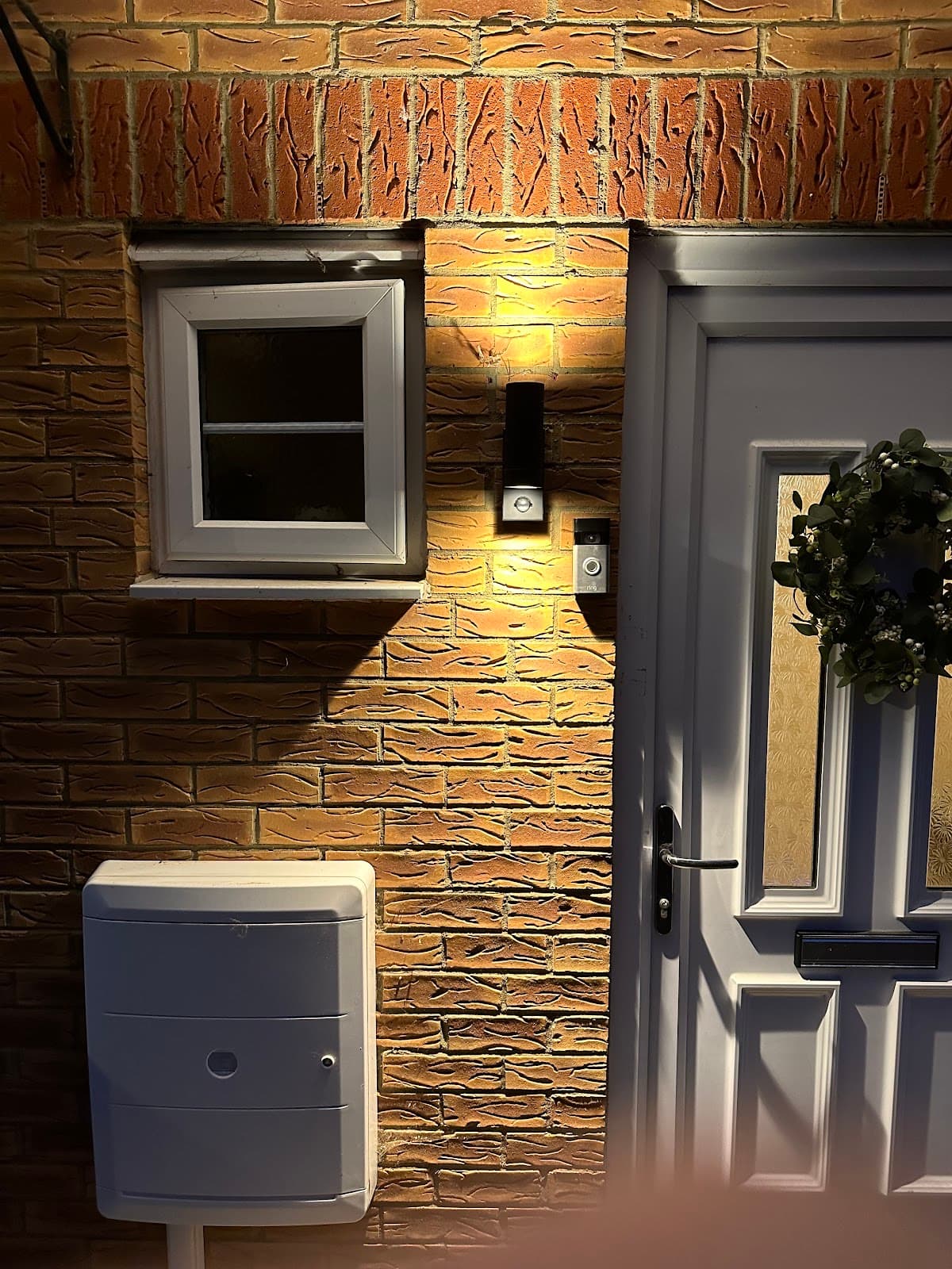 Outdoor wall light and Ring doorbell fitted by a front door
